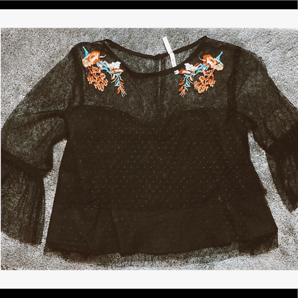 Black, bellbottom sleeved blouse